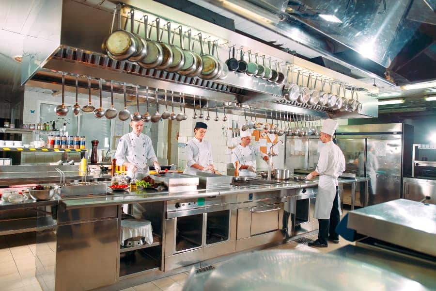 Chefs at hotel working in the kitchen