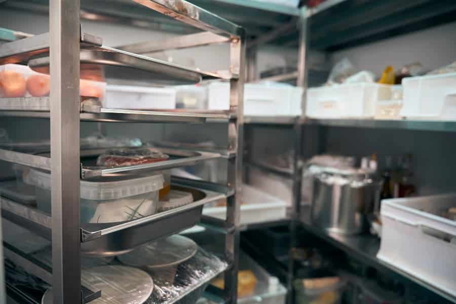 Walk-in cooler in restaurant filled with food